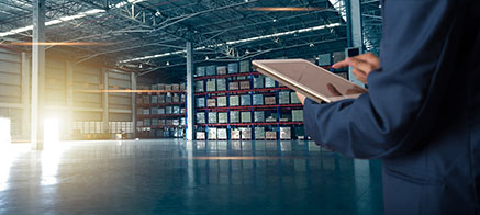 Businessman manager using tablet check and control for workers with Modern Trade warehouse logistics. Industry 5.0 concept