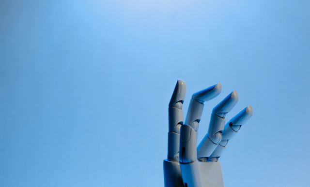 A robotic hand reaches upwards into the distance | Celigo