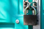 A close up image of a padlock holding a door together | Logpoint