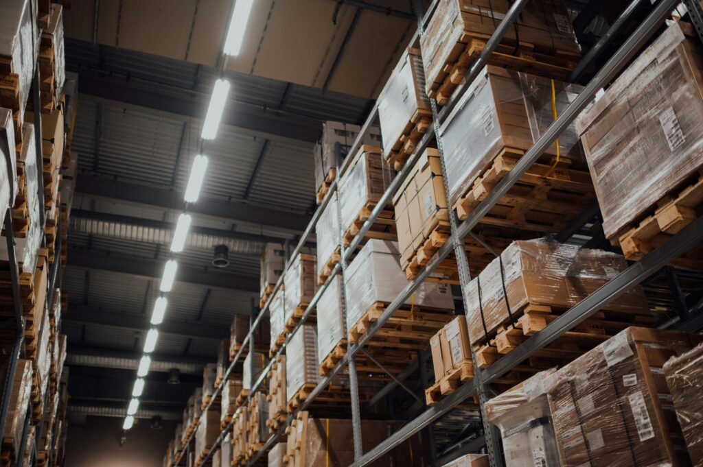 photograph of a warehouse with boxes places on shelves