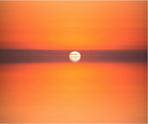 photograph of a bright orange sunset, end of SAP SolMan maintenance concept