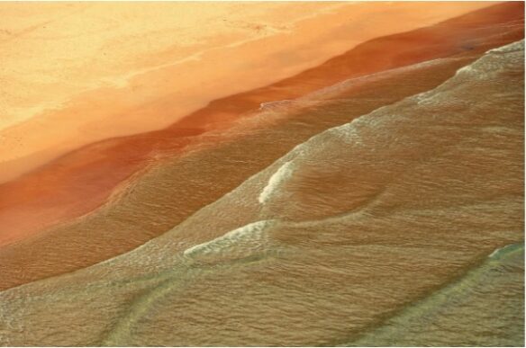 a sky-level photograph of a beach during sunset; automation and progress concept