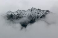 photograph of a mountain range in front of a cloudy sky and weather, cloud