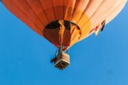 image of orange hot air balloon in blue sky