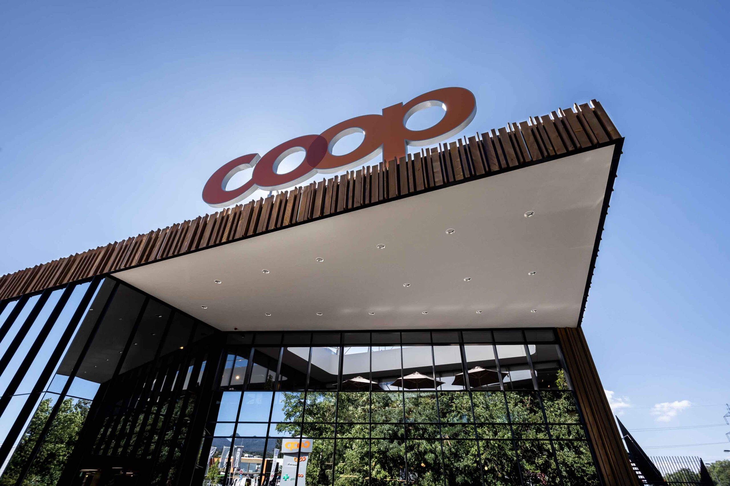 Image of Coop Switzerland building against blue sky | SNP