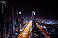 Image of a smart city at night, lights of traffic everywhere | CNT Management Consulting brownfield