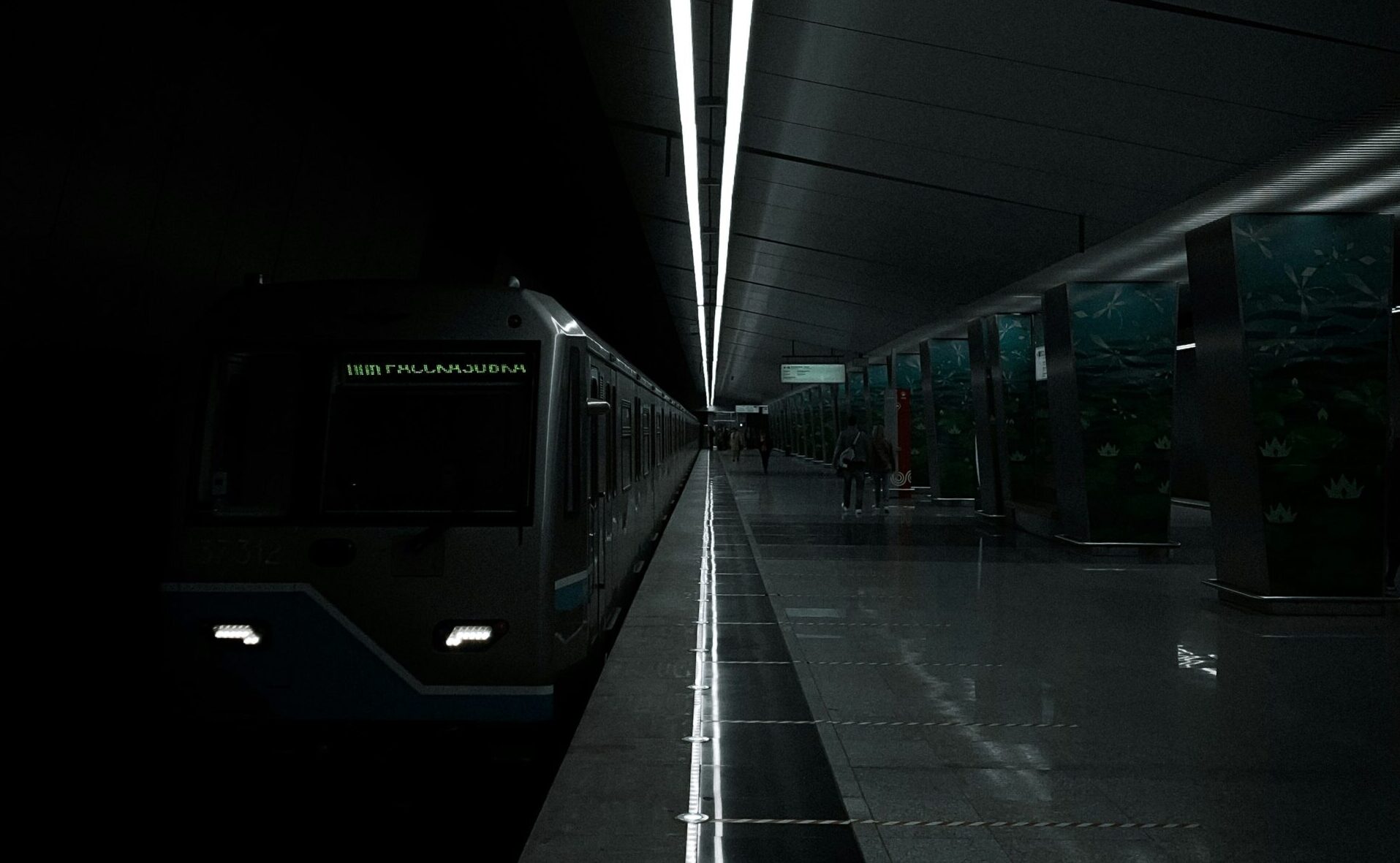 photo of a train station with very low brightness and lines of light in the middle | REALTECH's SAP retrofitting solution