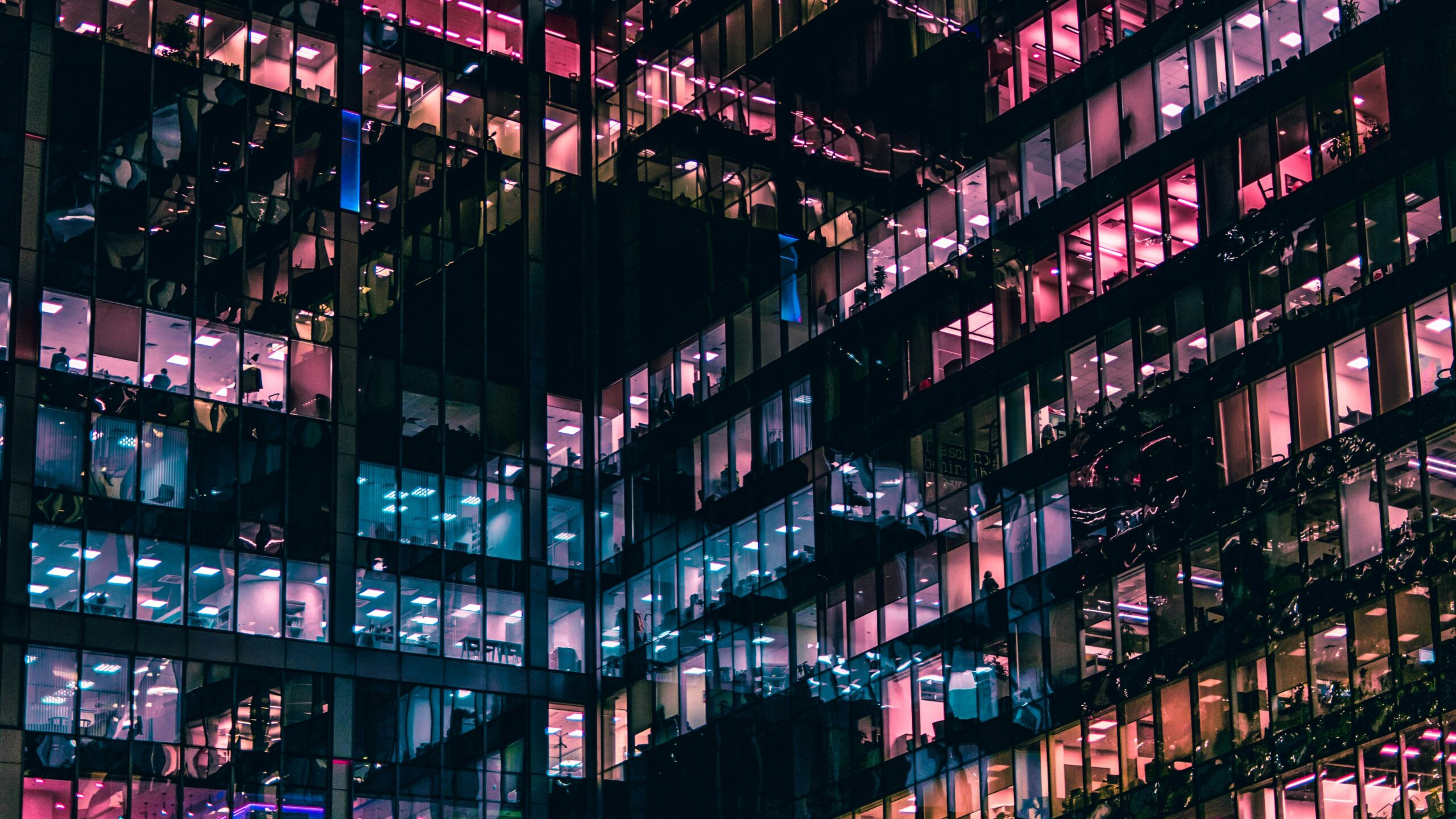 photo of an office building with people in it during nighttime | SAP Product Review of SAP BTP