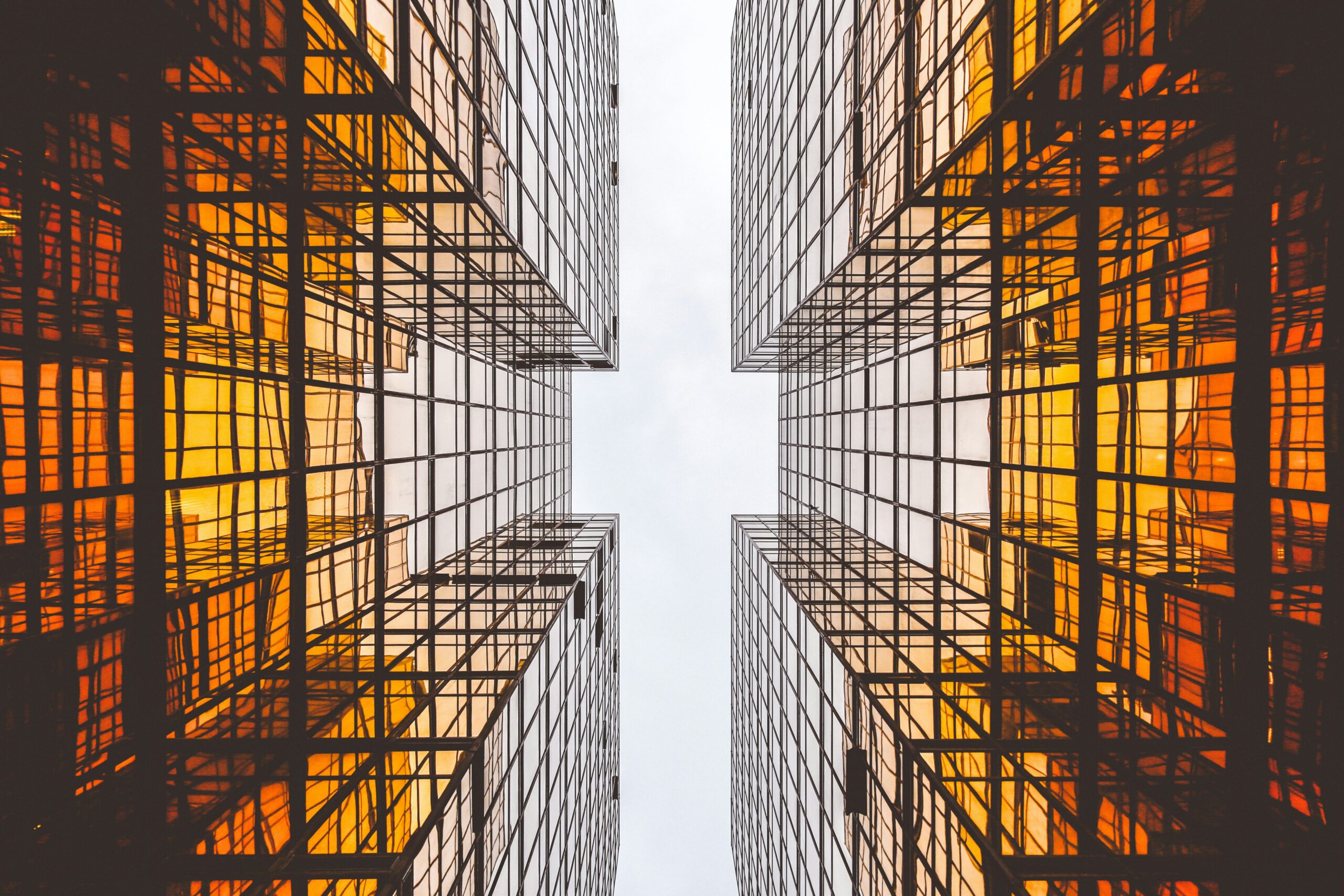 worms eye view of orange reflective architecture | SAP Product Review of SAP Integration Suite