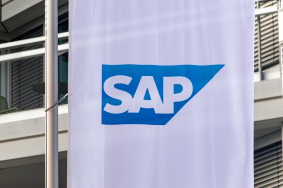 SAP logo on a vertical banner outside an office building.
