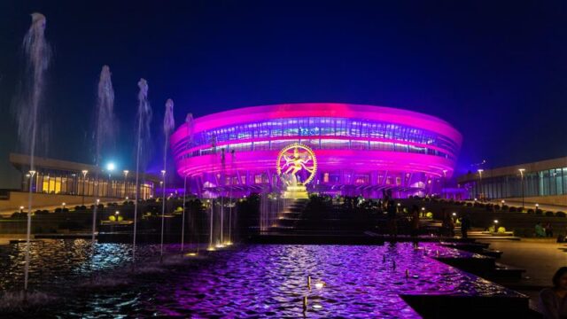 Bharat Mandapam illuminated in New Delhi during the India AI Impact Summit 2026, venue for global AI infrastructure and enterprise technology discussions.