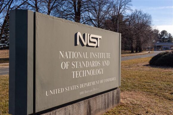 Sign at the National Institute of Standards and Technology (NIST) headquarters, reflecting changes to CVE handling and vulnerability data management.