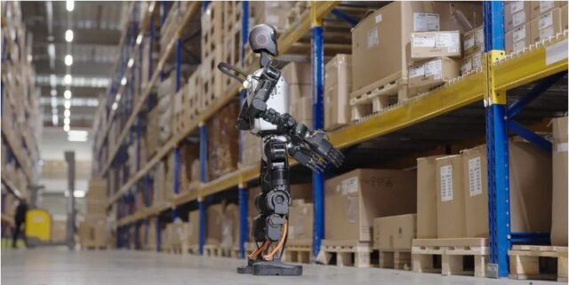 A humanoid robot checking for misplaced or improperly stacked items_ SAP warehouse humanoid robot pilot