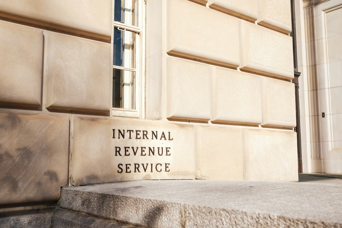 Internal Revenue Service building exterior with IRS signage on stone wall.