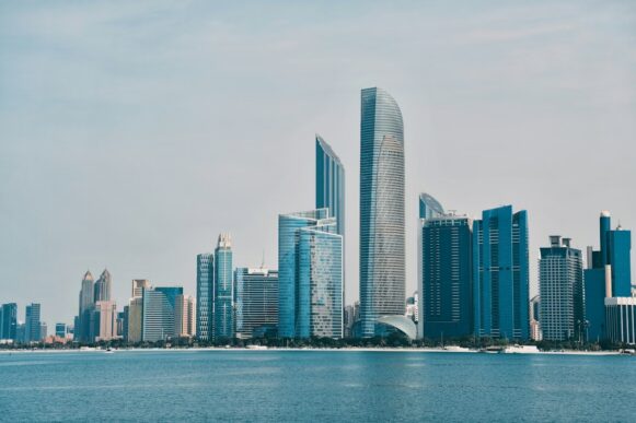 Abu Dhabi skyline with modern high-rise buildings along the waterfront.
