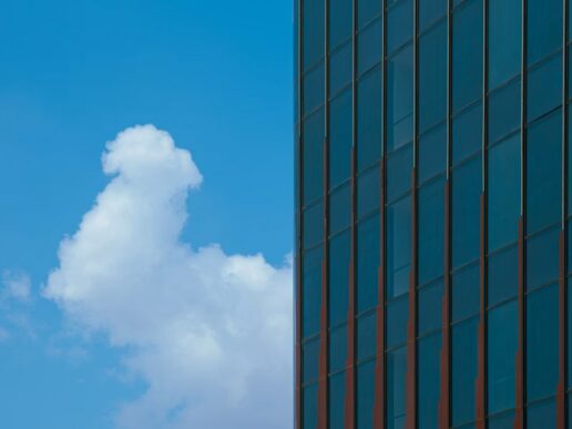 Office building against a blue sky representing cloud migration and clean core alignment for Pathlock’s RISE with SAP certification.
