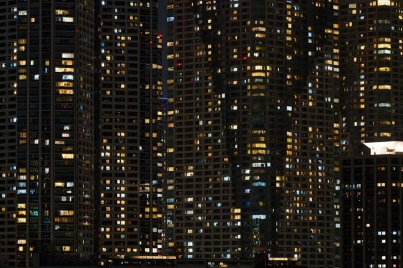 Buildings lit at night illustrating 24/7 managed SAP security, continuous threat monitoring, and always-on enterprise protection.