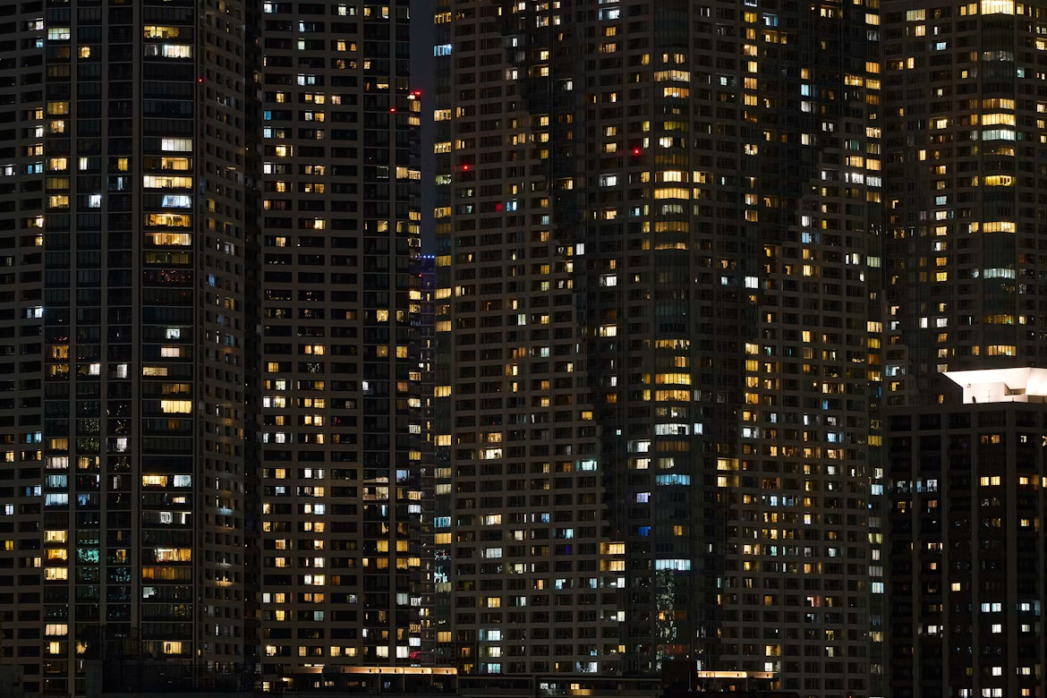 Buildings lit at night illustrating 24/7 managed SAP security, continuous threat monitoring, and always-on enterprise protection.