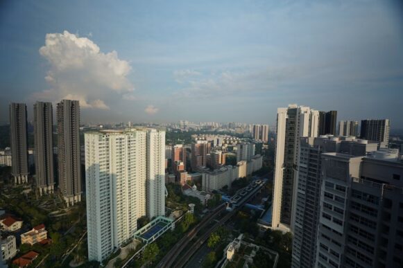 High-rise buildings and rail lines in Queenstown, Singapore, near the planned Kampong AI hub at one-north