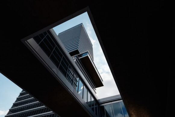 Modern office tower viewed through geometric architecture, illustrating Zero Trust security for SAP autonomous AI agents.
