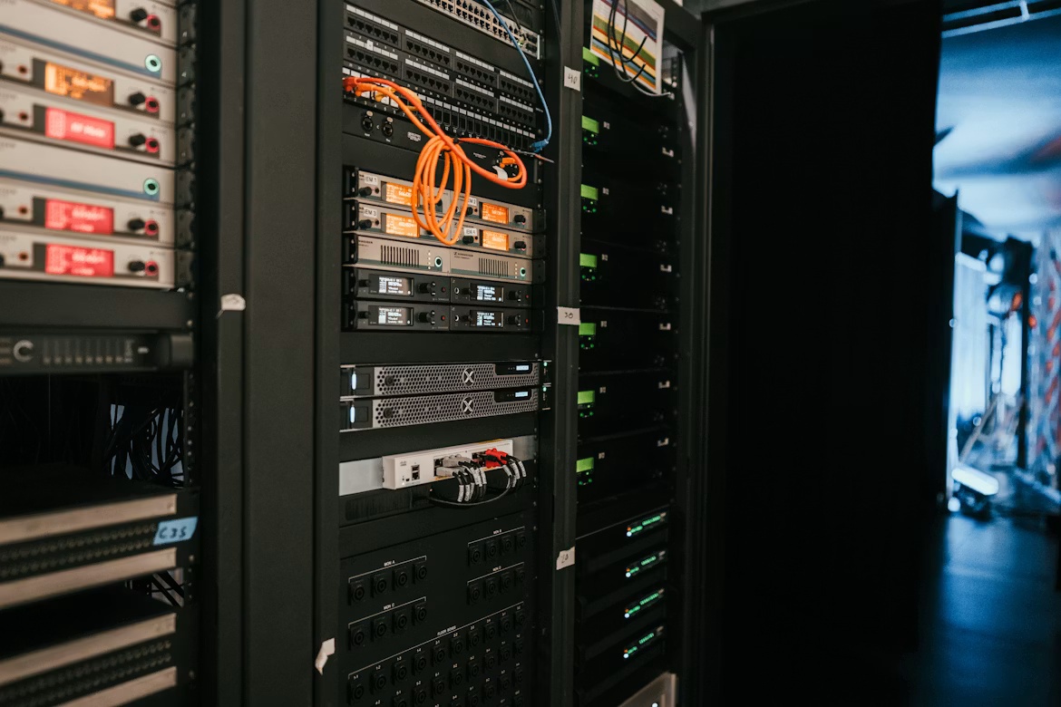 Server racks and networking equipment in a data center, representing SAP data archiving and HANA migration infrastructure.