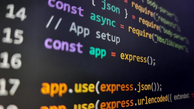 Close-up of API integration code on a dark screen showing JSON and endpoint configuration, representing the interfaces governed by SAP's new API Policy