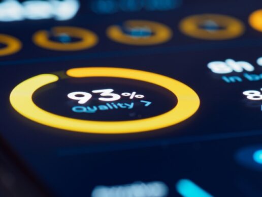Close-up of a dark digital dashboard displaying a 93 percent quality metric within a glowing yellow circular progress bar, representing software testing analytics.