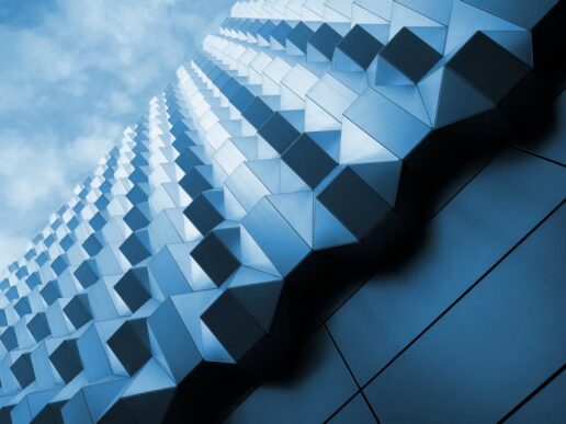Abstract blue geometric building facade representing SAP BTP architecture for clean-core indirect tax compliance