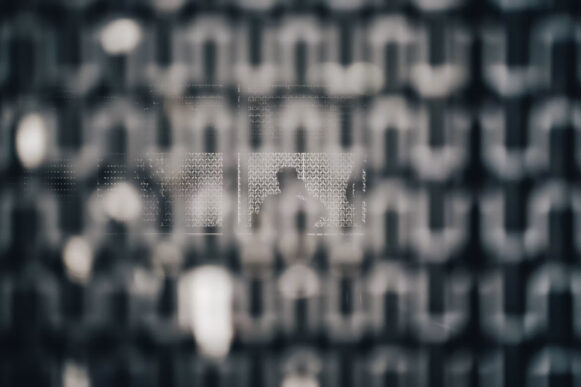 Abstract reflected pattern representing invisible watermarking and AI content provenance in Claude-generated text.