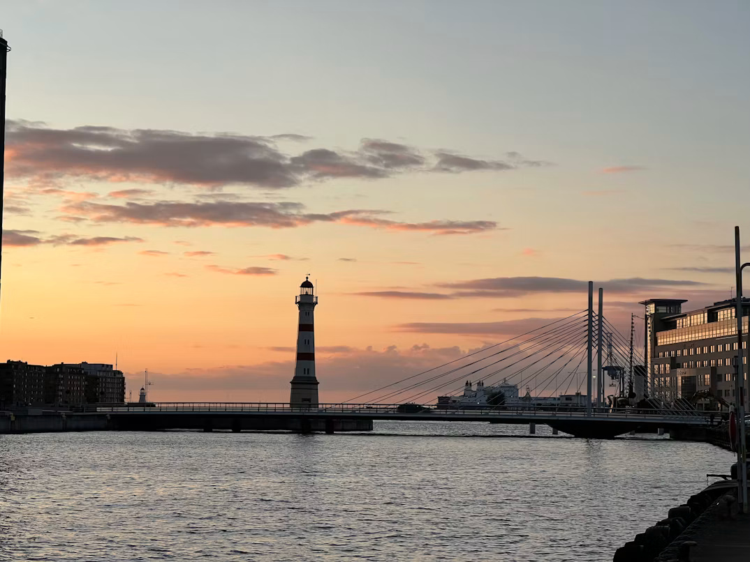Malmö waterfront with lighthouse and bridge at sunset, representing Inriver’s Digital Product Passport partnership with OrigoVero