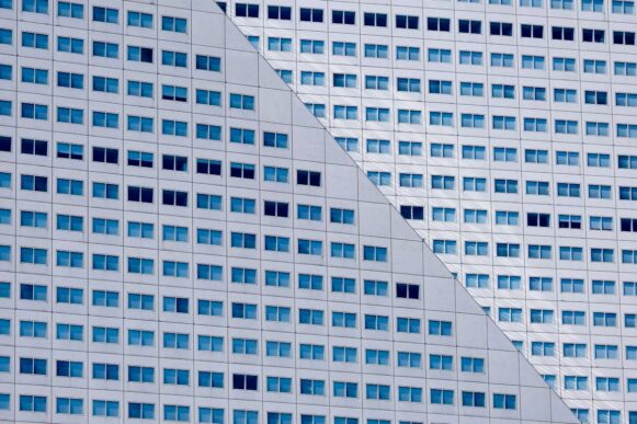Geometric office building façade representing structured SAP document capture governance