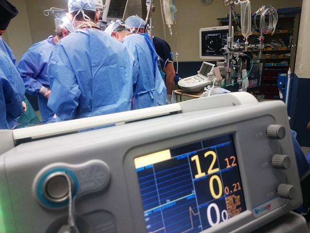 Surgical team in an operating room surrounded by medical monitors and equipment, representing the hospital buyers and clinical products behind Boston Scientific's AI-powered B2B product discovery on SAP Commerce Cloud