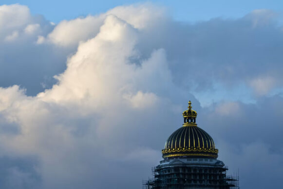 European building beneath cloud-filled sky illustrating sovereign cloud and digital sovereignty.