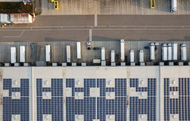 Aerial view of trucks at a warehouse loading dock supporting industrial supply chain operations