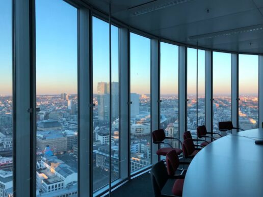 Modern office conference room overlooking a city skyline, illustrating SAP Autonomous HCM and AI-supported workforce decision-making.