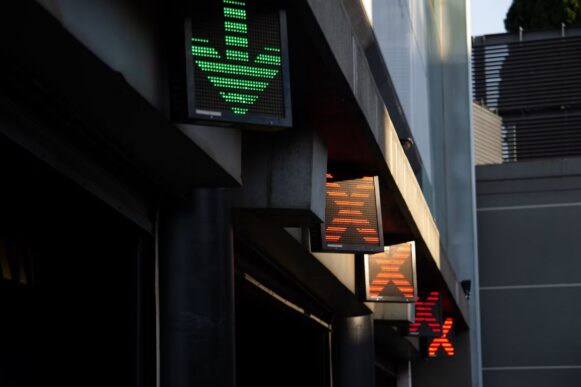 Pedestrian signals showing a green arrow and red crosses, illustrating controlled access across SAP BTP and connected systems.