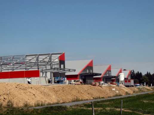 Data center campus under construction with multiple industrial buildings and infrastructure.