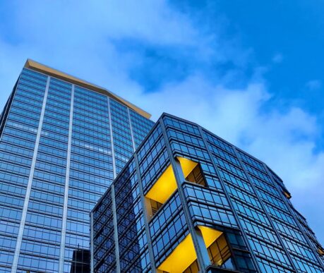 Modern stepped office buildings illustrating SAP S/4HANA data volume reduction and harmonization