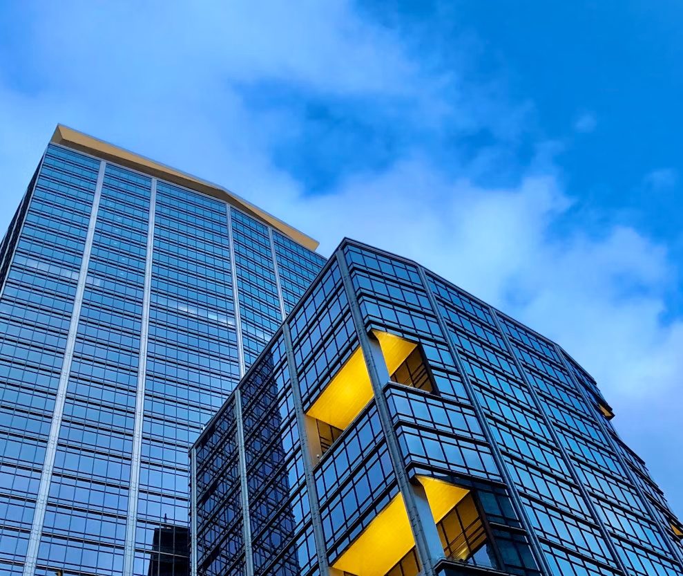 Modern stepped office buildings illustrating SAP S/4HANA data volume reduction and harmonization