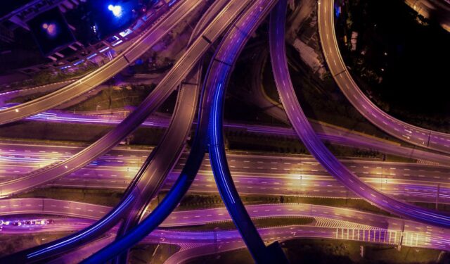 Aerial view of interconnected highways at night illustrating SAP architecture visibility and security exposure.